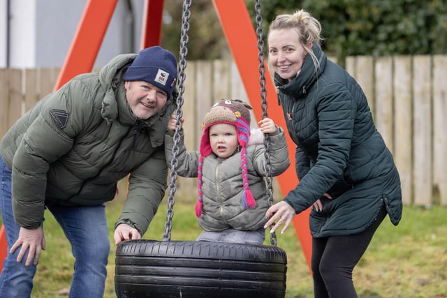 Enjoying the new play equipment at Armoy Playpark.