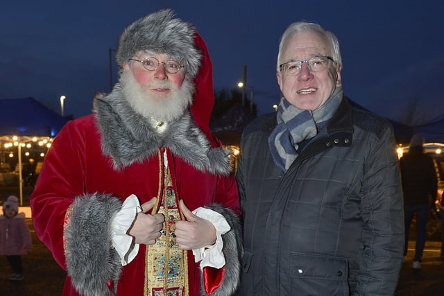 Pictured at the Carryduff Christmas Market is (l-r) Santa Claus with Alderman Allan Ewart MBE, Chairman of Lisburn & Castlereagh City Council’s Development Committee.