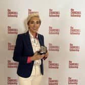 Edendork woman Nicole Devlin, PhD Researcher, receives a prestigious Churchill Fellowship medallion having successfully completed her research into an evidence-based violence prevention programme at an Award Ceremony held in London. Credit: Supplied