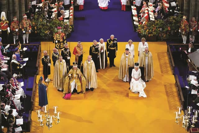 King Charles III and Queen Camilla after being crowned during their coronation ceremony in Westminster Abbey, on May 6, 2023 in London, England. The Coronation of Charles III and his wife, Camilla, as King and Queen of the United Kingdom of Great Britain and Northern Ireland, and the other Commonwealth realms takes place at Westminster Abbey today. Charles acceded to the throne on 8 September 2022, upon the death of his mother, Elizabeth II. (Photo by Andrew Matthews - WPA Pool/Getty Images)