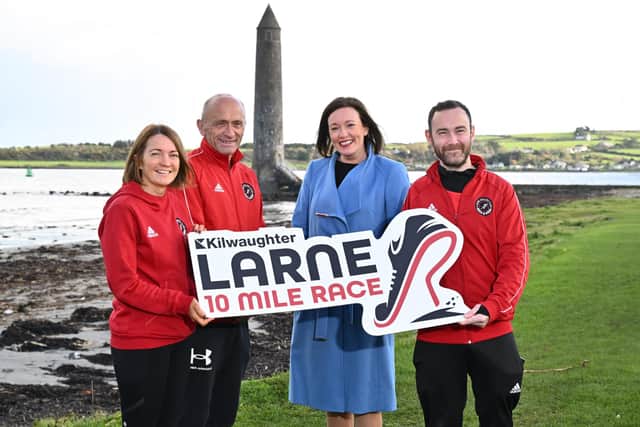 William Thompson, chairman of Larne Athletic Club and Caroline Rowley, business development director at Kilwaughter Minerals, with Larne Athletic Club members. Photo submitted