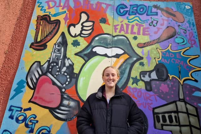 Niamh Murray (24) outside Clann Éireann GAA Club where she began her stellar career as a Gaelic footballer. Niamh is also a professional singer, has written her own songs and regularly performs locally.