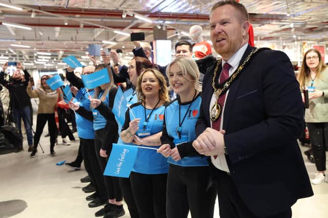 Primark colleagues welcome the first customers into the store with Cllr Paul Greenfield, Lord Mayor of Armagh City, Banbridge & Craigavon Borough Council.