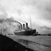 The RMS Titanic leaving Belfast to start her trials, being pulled by tugs, shortly before her disastrous maiden voyage of April 1912.