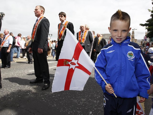 TWELFTH WAVE...Cole Annesley waves his flag during the Coleraine Twelfth in 2008.