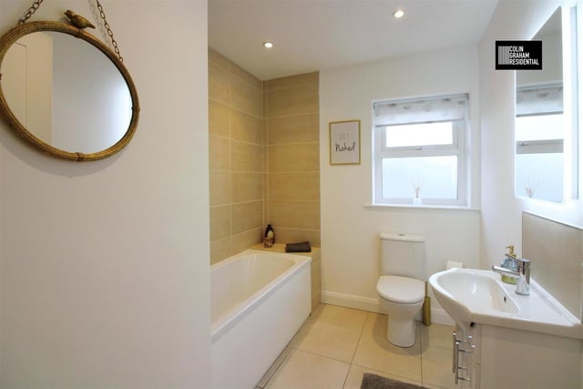 Deluxe family bathroom with contemporary three piece suite.