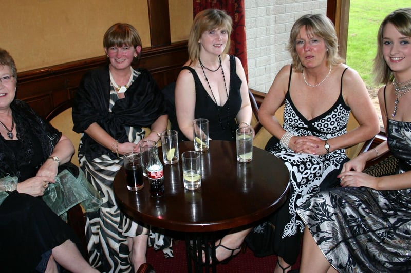 All smiles for the camera as these ladies pose for the camera at a 70th Anniversary Dinner Dance for the Robinson Board at Ballymoney Rugby Club in 2007