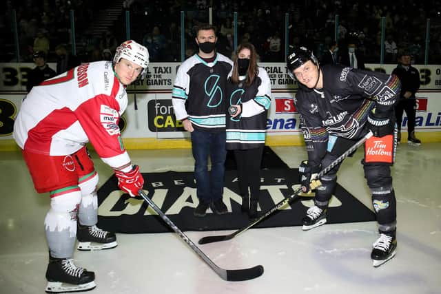Mark Richardson, Cardiff Devils; Stephen Somers, Co-Founder of Marketplace Superheroes; Caitlin Hunter, Marketplace Superheroes; and Mark Cooper, Belfast Giants on the ice at The SSE Arena, Belfast