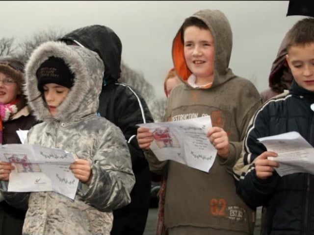 Students from St MacNissi's Primary School performing at the New Mossley Christmas lights switch on event in 2006.