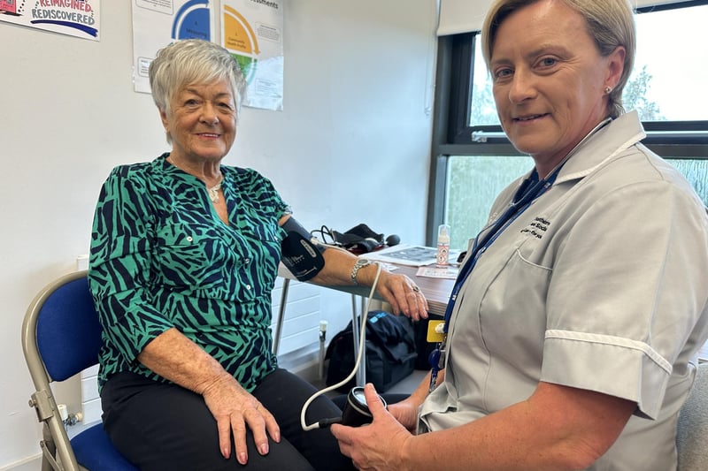 Wilma gets her blood pressure checked by Sharon from the Southern Health and Social Care Trust.