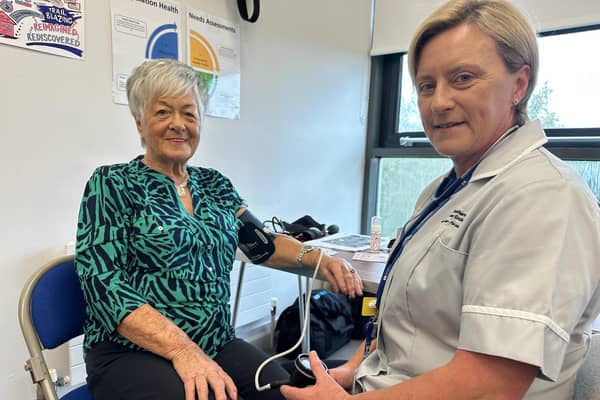 Wilma gets her blood pressure checked by Sharon from the Southern Health and Social Care Trust.