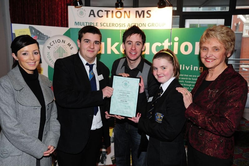 Cool FM DJ Connor Phillips (centre) congratulates Carrick College pupils on raising, along with their counterparts at Carrickfergus Grammar School, £12,000 for Action MS in 2009. CT04-708