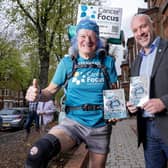 Lisburn man Stewart Barbour, author of ';AAS Barbour - 70 Not Out' and Cancer Focus CEO Richard Spratt. Pic credit: Cancer Focus