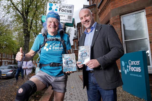 Lisburn man Stewart Barbour, author of ';AAS Barbour - 70 Not Out' and Cancer Focus CEO Richard Spratt. Pic credit: Cancer Focus
