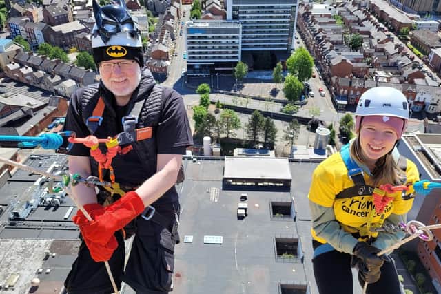 Alastair taking part in the Take on the Tower Superhero Abseil in 2022 with his daughter Erin. Pic credit: Friends of the Cancer Centre