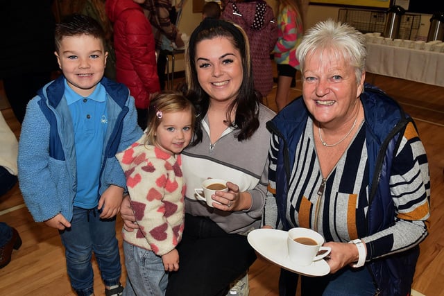 Having a good time at the Epworth Playgroup 10th anniversary coffee morning are from left, Archie Winter (4), Mollie Winter (2), Robyn Turkington and Ann Turkington. PT48-233.