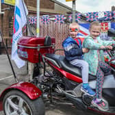 The Royal British Legion's celebrations provided these young members of the community with an opportunity to try out a trike. Pics by Norman Briggs RnBphotographyni