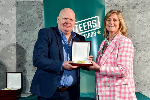 Micky Fleming from Churchlands Golden Gloves receives his award from Federation of Irish Sport Chairperson Clare McGrath during the Volunteers in Sport Awards at The Crowne Plaza in Blanchardstown, Dublin