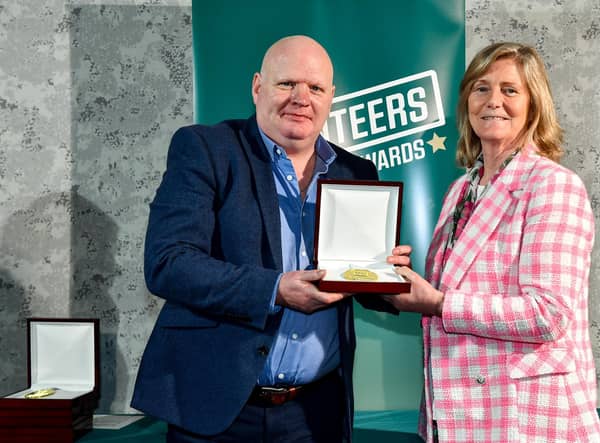Micky Fleming from Churchlands Golden Gloves receives his award from Federation of Irish Sport Chairperson Clare McGrath during the Volunteers in Sport Awards at The Crowne Plaza in Blanchardstown, Dublin