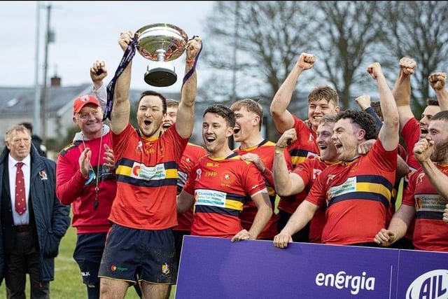 Ballyclare players celebrate lifting the trophy in Dundalk.