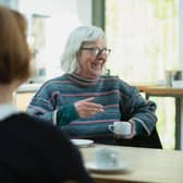 Armagh City, Banbridge and Craigavon Borough Council is to join a scheme aiming to encourage conversations between people in cafés. Credit: Age Cymru / Unsplash