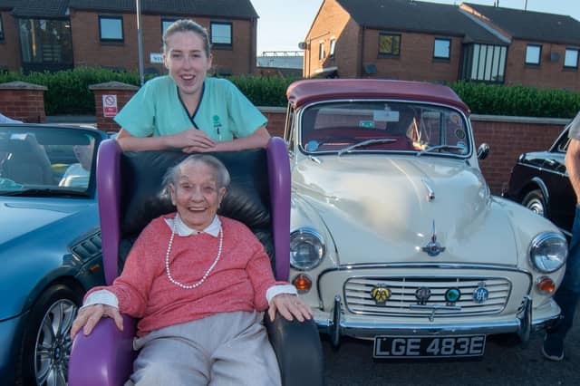 Looking happy at the vintage rally are Mahon Hall resident, Gladys Stevenson and care assistant, Olivia Jones.