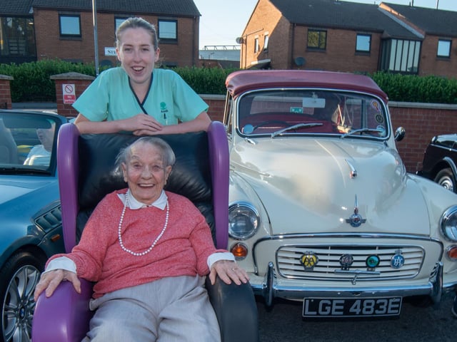 Looking happy at the vintage rally are Mahon Hall resident, Gladys Stevenson and care assistant, Olivia Jones.