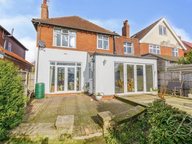 Taking a step outside, we see the Robin Down Lane property in all its glory from the rear. The two sets of double doors lead from the lounge and kitchen/diner on to a block-paved area or a decked seating area.