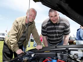 Ronnie McBride and John Cochrane look at an engine during the Ford Fair at the Dunluce Centre in 2009
