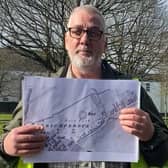 Ruairí Ó Baoill, excavations director with the Centre for Community Archaeology at QUB with a 1830s map of the area around Shaftesbury Park. Photo: NI World