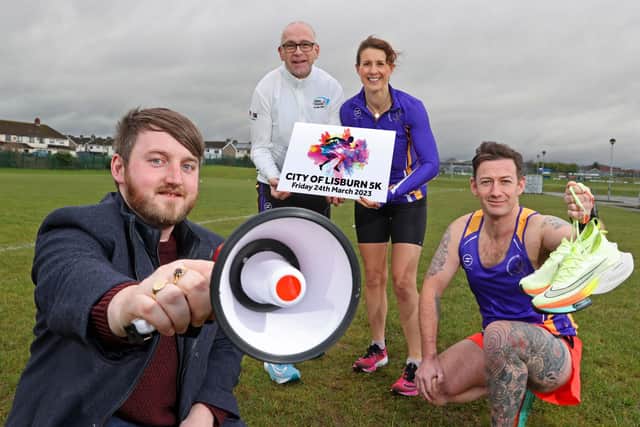 Councillor Aaron McIntyre, Chair of Leisure & Community Development Committee and Adrian Daye from Jog Lisburn & Atlas Running is joined by local runners from Jog Lisburn to launch the City of Lisburn 5K