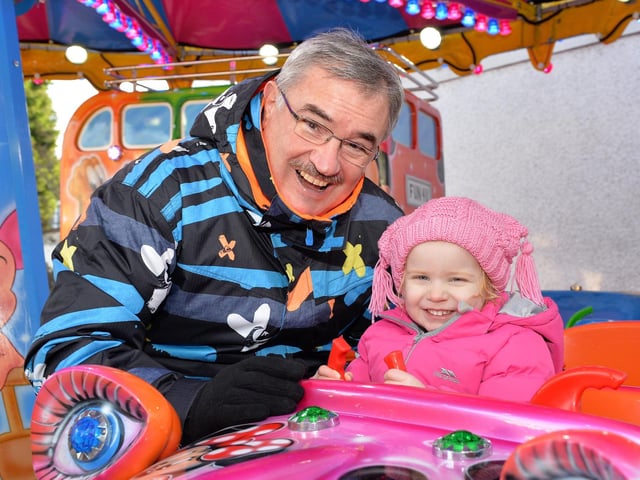 Geoff Calvert and granddaughter Isla have fun at the Whitehead Victorian Street Fair in 2017.