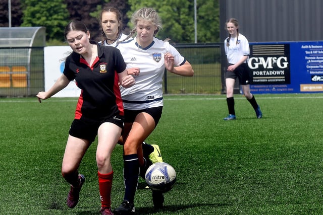 Markethill High School (white) players in action at the Electric Ireland schoolgirls soccer tournament at Lurgan Town FC on Friday. PT21-231.