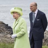 The late Queen Elizabeth and Duke of Edinburgh during their 2016 visit to the Giant's Causeway. Credit News Letter