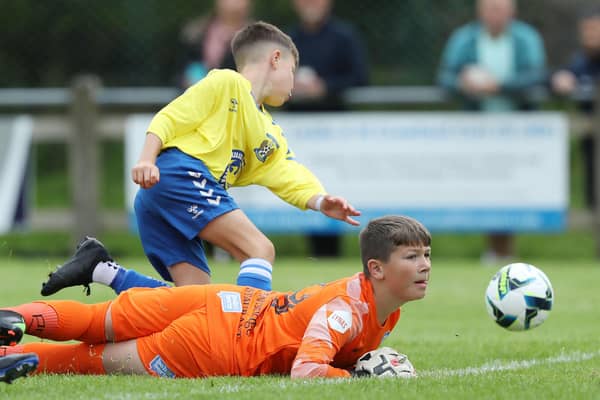 Coleraine's Syzmon Bednarz  and Kilmarnock's  Frankie Nolan during Tuesday's Boys Minor Group B match at Broughshane.