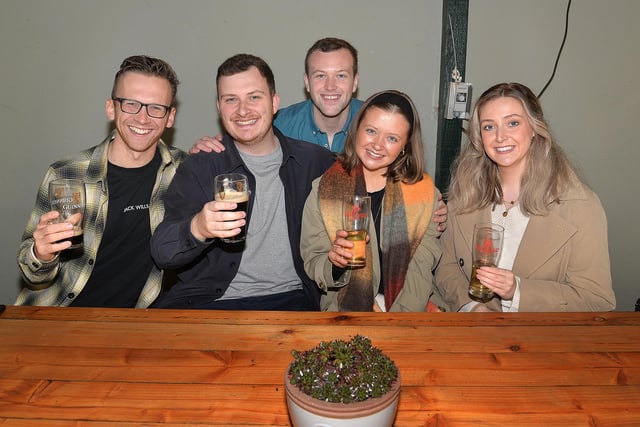 Enjoying a drink in the cider tent at the Richhill Apple Harvest Fayre are from left, Chris Webb, Joe McKeown, Nathan Montgomery, May McKeown and Zoe Burns. PT44-245.