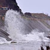 Waves crash against the Coast Road near Glenarm on Monday.