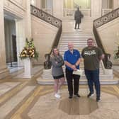 David Hilditch (centre) delivering his letter of resignation from the Assembly at Stormont, accompanied by DUP colleagues, Councillors Cheryl Brownlee and Marc Collins. Photo submitted by the DUP