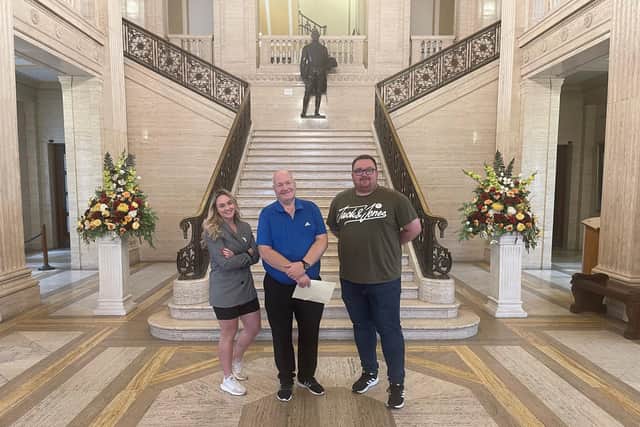 David Hilditch (centre) delivering his letter of resignation from the Assembly at Stormont, accompanied by DUP colleagues, Councillors Cheryl Brownlee and Marc Collins. Photo submitted by the DUP
