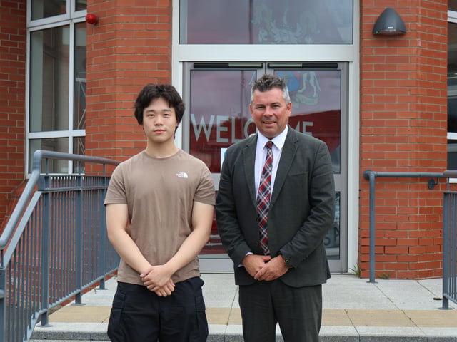 5 A Star Grades student pictured with the headmaster Mr Mark McCullough.