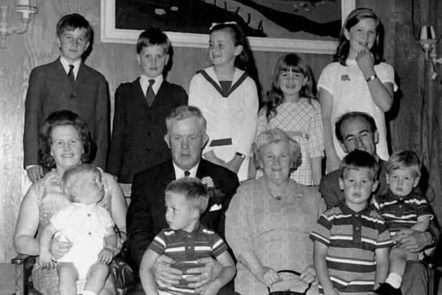 This photo of the McCaffery family was taken around 1970 in a place called The Woodwin in Woodhouse Street, Portadown in the area the Yellow Door is now and next door to the old Portadown Times office. There are nine children in the McCaffery family at the time pictured with their parents, and their mother's parents, Granda and Granny McParland from Coronation Street.