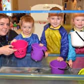 Enjoying some water play with naíscoil deputy leader, Shauneen McGeown are from left, Cian, Finn and Maeve. PT43-301.