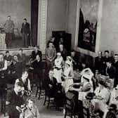 Gas attacks were considered a very real threat in 1939. The Government decided that gas masks should be issued to every man, woman and child. Some 38 million masks were needed for the civilian population and were distributed throughout the UK in small cardboard boxes.  Pictured here is the distribution of gas masks by the Red Cross in Carrickfergus Town Hall, 1939.  Photo: Carrickfergus Museum