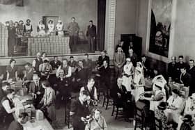 Gas attacks were considered a very real threat in 1939. The Government decided that gas masks should be issued to every man, woman and child. Some 38 million masks were needed for the civilian population and were distributed throughout the UK in small cardboard boxes.  Pictured here is the distribution of gas masks by the Red Cross in Carrickfergus Town Hall, 1939.  Photo: Carrickfergus Museum