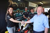 Briggs Equipment North West 200 race director, Mervyn Whyte, pictured with FHO Racing BMW team boss, Faye Ho and riders, Peter Hickman and Davey Todd, at the Macau Grand Prix where it was agreed the squad would return to the NW200 in 2025 after a two year break. PICTURE BY STEPHEN DAVISON