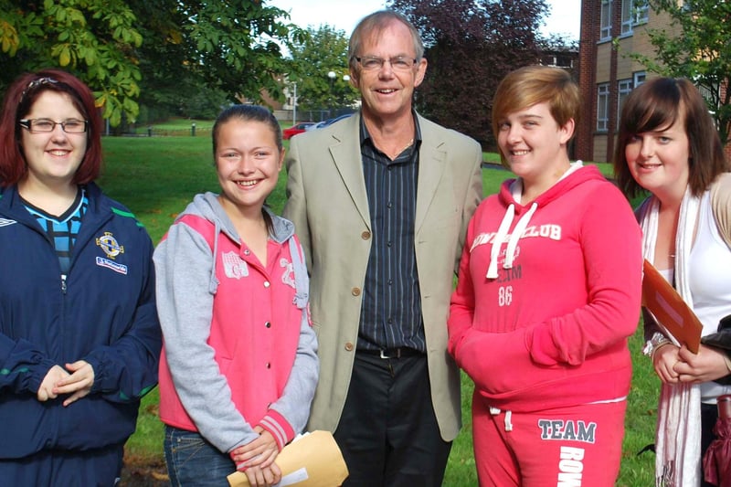 Pictured with Mr Lewis are Taylor Finney, Lindsey Webb, Rhea McCorey, and Ashleigh Hill, who received their GCSE results at Newtownabbey Community High School in 2011. INNT 35-715-JN