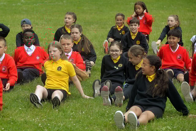 Hart Memorial Primary School and Presentation Primary School pupils listen to the Healthy Kidz coach during their Shared Education Fun Dy in Portadown People's Park. PT24-201.