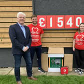 Head of BHFNI Fearghal McKinney, on left, pictured at Stanley Park, Lisburn with, Jamie, Beth and Jacqui English who raised £1,540 for the BHF in memory of the late Tommy English.