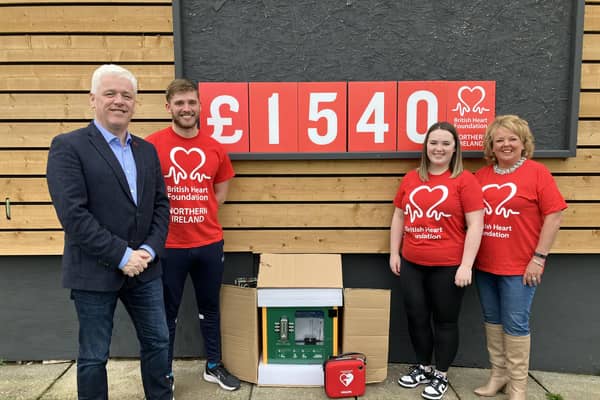 Head of BHFNI Fearghal McKinney, on left, pictured at Stanley Park, Lisburn with, Jamie, Beth and Jacqui English who raised £1,540 for the BHF in memory of the late Tommy English.