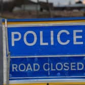 Road closed PSNI.